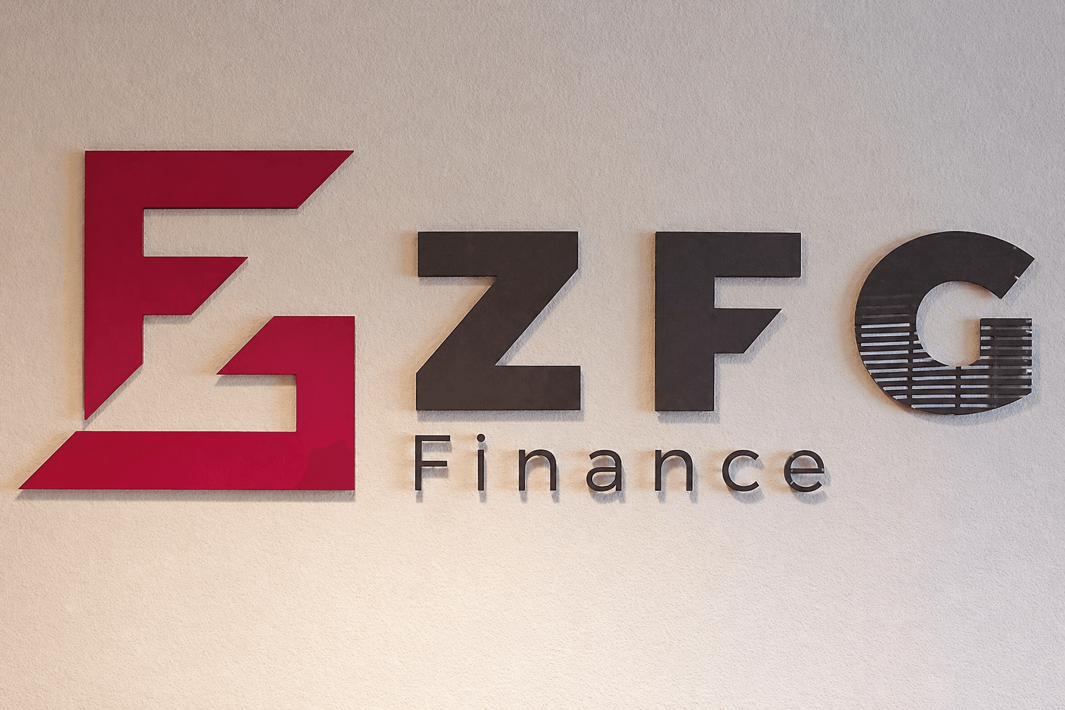ZFG Finance wandlogo met rode beeldmerkplaat en zwarte 3D letters, gemonteerd op een lichte structuurmuur als zakelijke binnenreclame.
